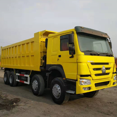 시노트루크 HOWO 8X4 371HP 수동 변속기와 함께 사용 된 노란색 덤프 트럭