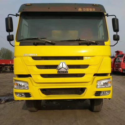 시노트루크 HOWO 8X4 371HP 수동 변속기와 함께 사용 된 노란색 덤프 트럭